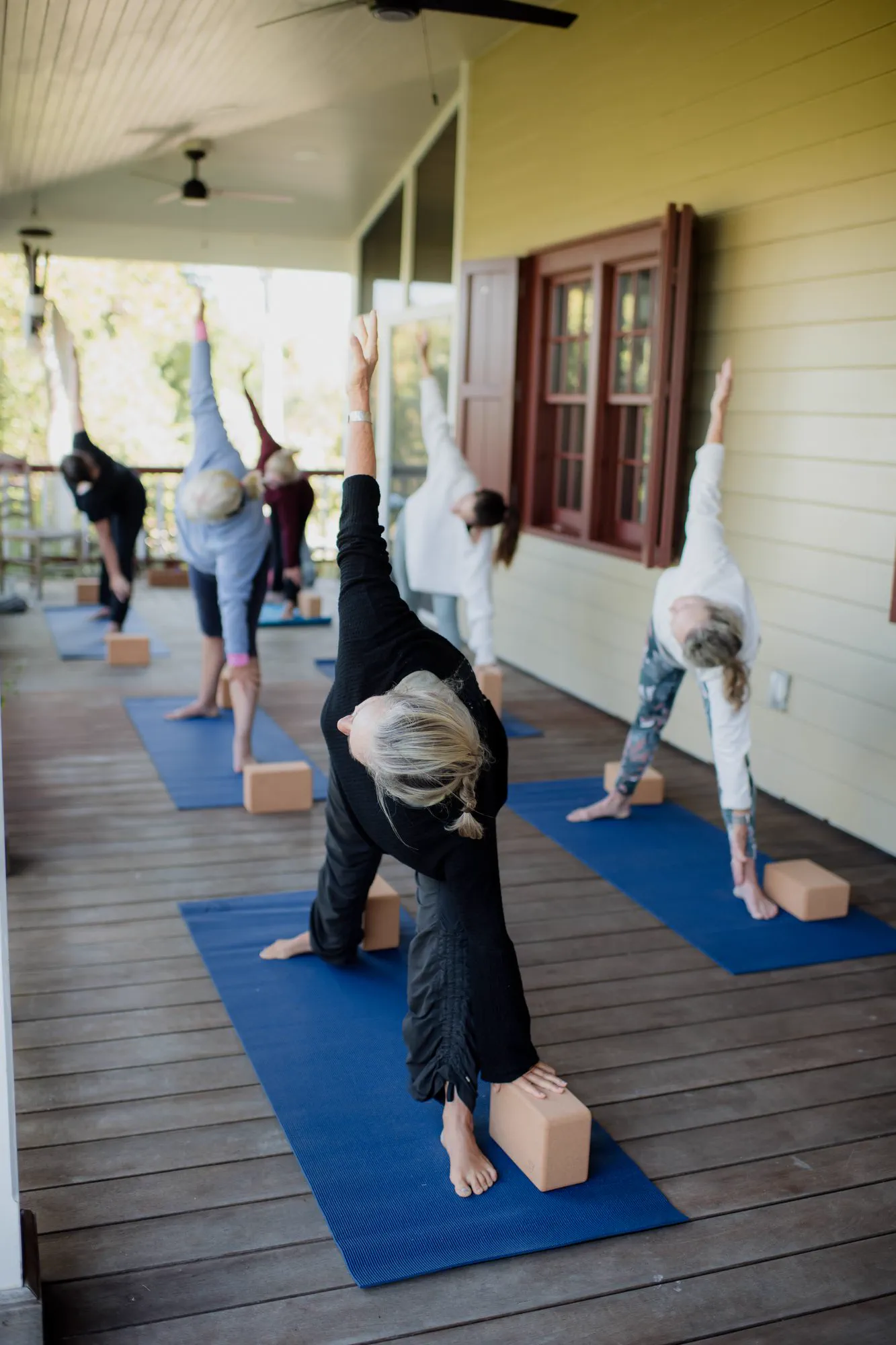 A private one-to-one yoga session on the covered veranda.