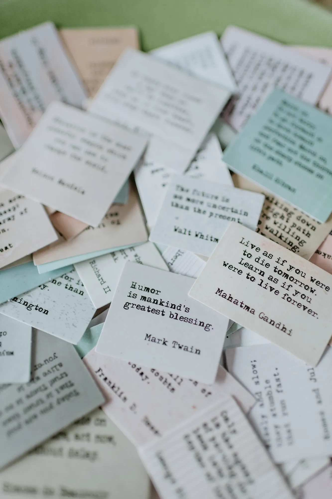 Folded affirmation strips scattered across a surface.